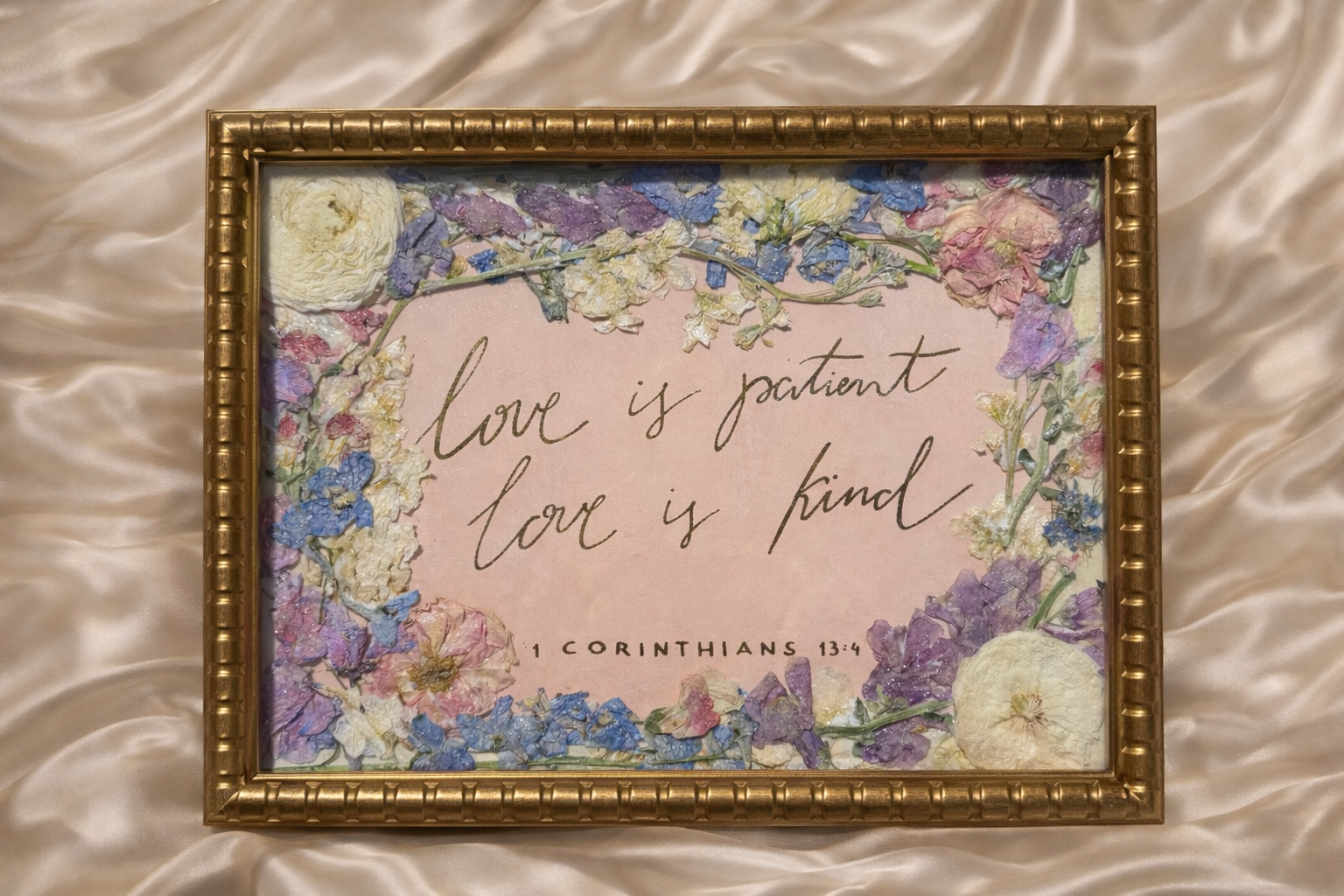 Decorative frame with floral design and text on a textured fabric background